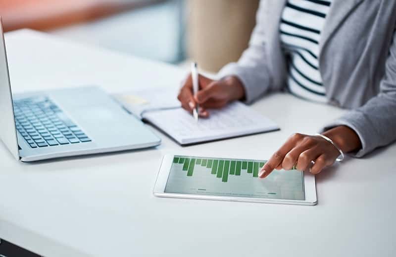 The Perils Of Picking A Family Member As Trustee image An image of a woman forecasting financial trends.