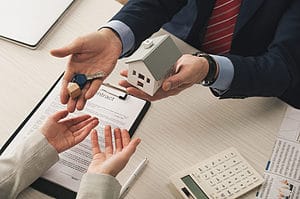 A close-up shot of business people turning over some ownership.