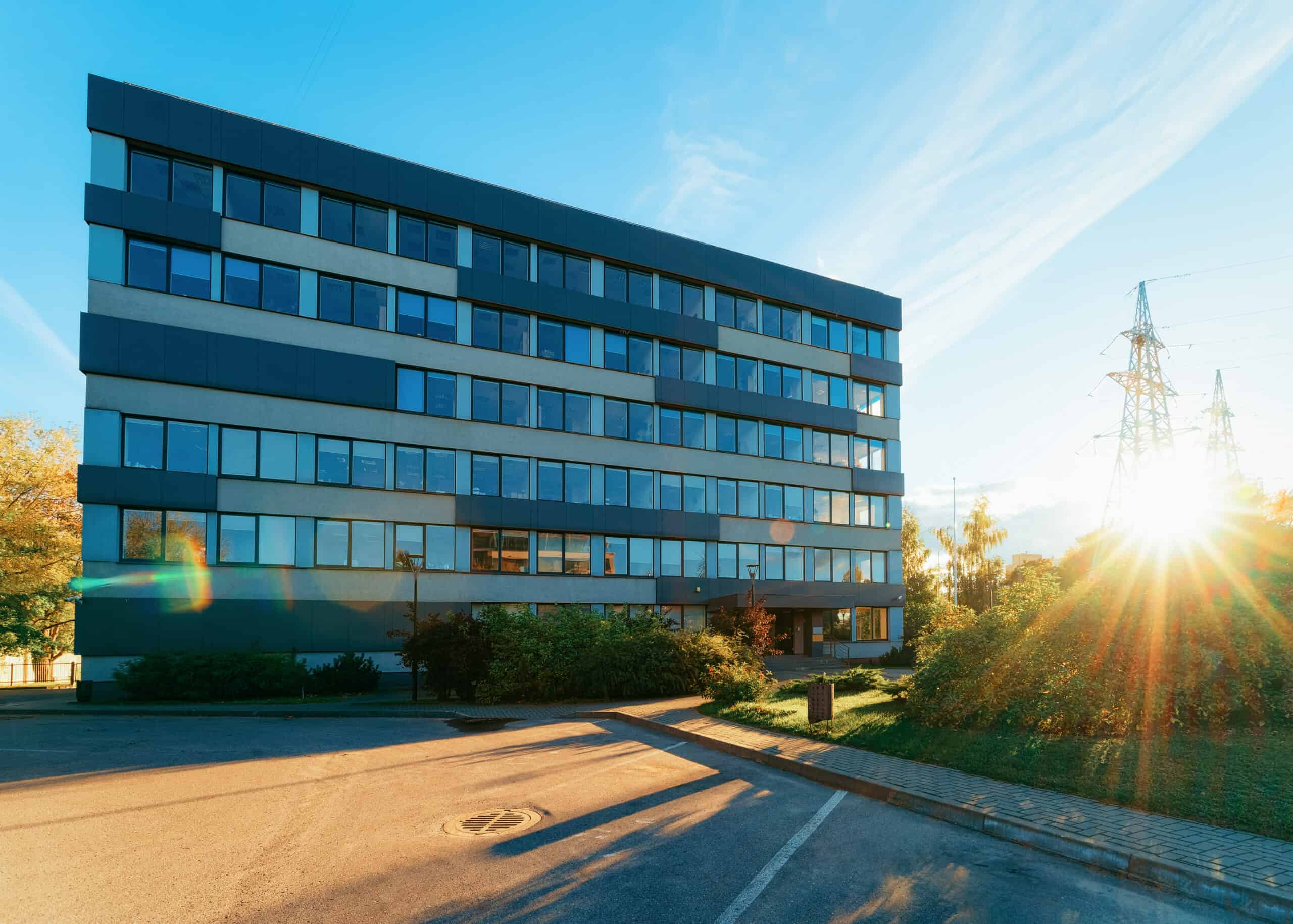 Corporate business office and street on background sun light.