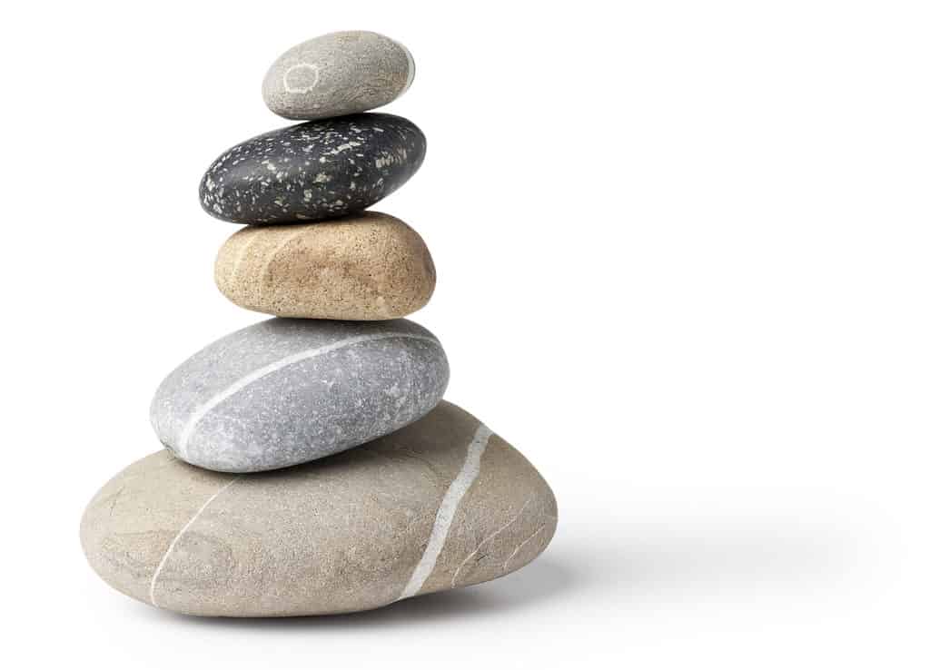 Balanced stone pile - Isolated on white with original shadows in high resolution and natural colors