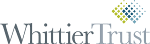 A colored vertical logo of Whittier Trust.