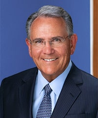 A professional headshot of André B. van Niekerk.