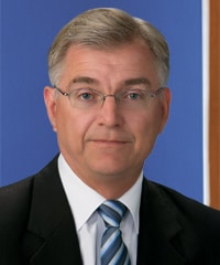 A professional headshot of David Covell.