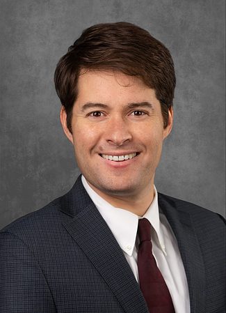 A professional headshot of Jay Karpen.