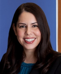 A professional headshot of Lindsey M. Cisneros.