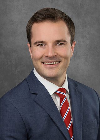 A professional headshot of Mathew Neben.