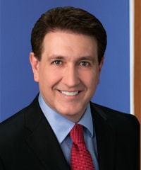 A professional headshot of Sean Kraus.