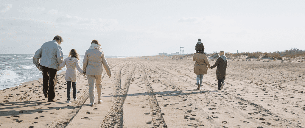 Family walking on beach